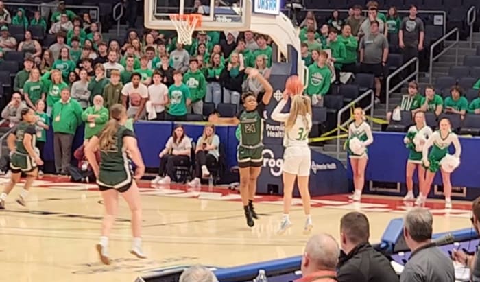 Fairland's Bailey Russell (No. 32) lets a 3-pointer fly in the state semifinals against Laurel on March 15, 2024.